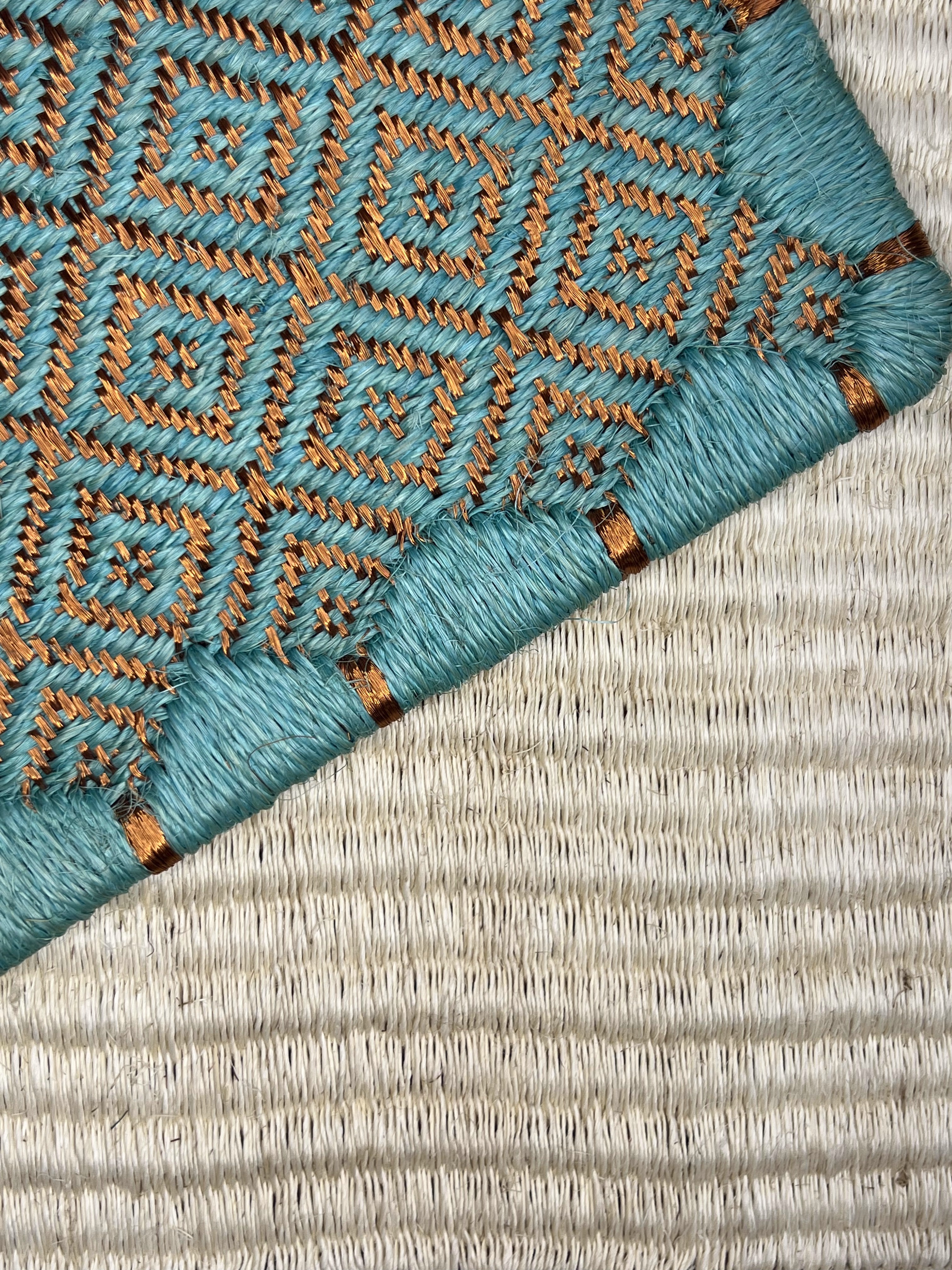 Cream With Teal and Orange Diamond Border Weave Area Rug